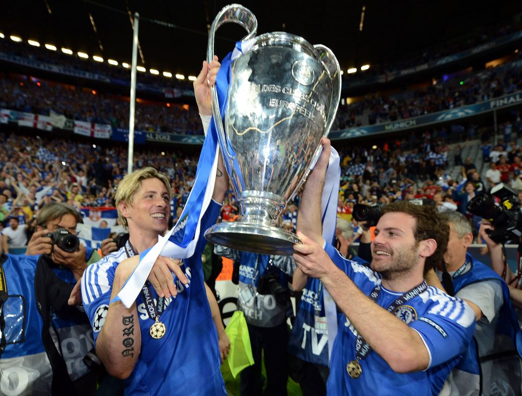 Fernando Torres and Juan Mata lifting the Champions League in 2012.