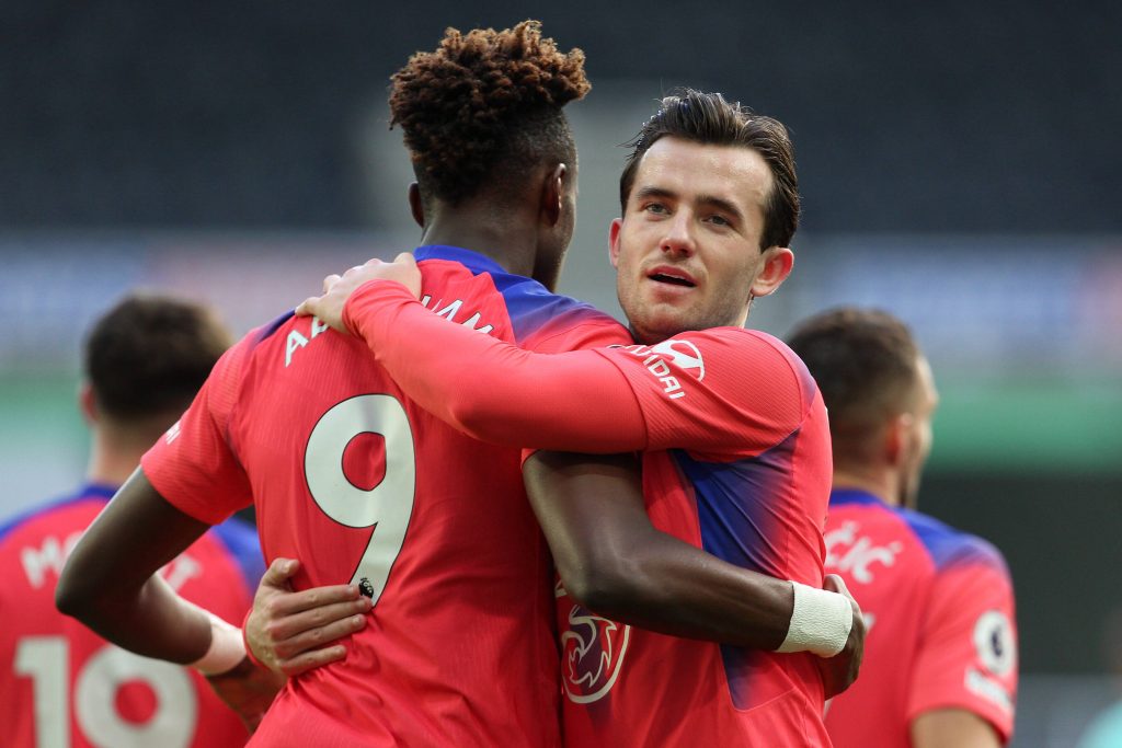 Tammy Abraham and Ben Chilwell celebrate a Chelsea goal together.