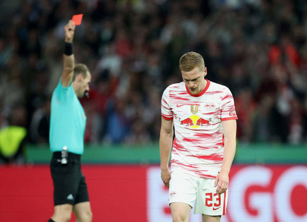 Marcel Halstenberg of RB Leipzig reacts after being shown a red card during the final match of the DFB Cup 2022