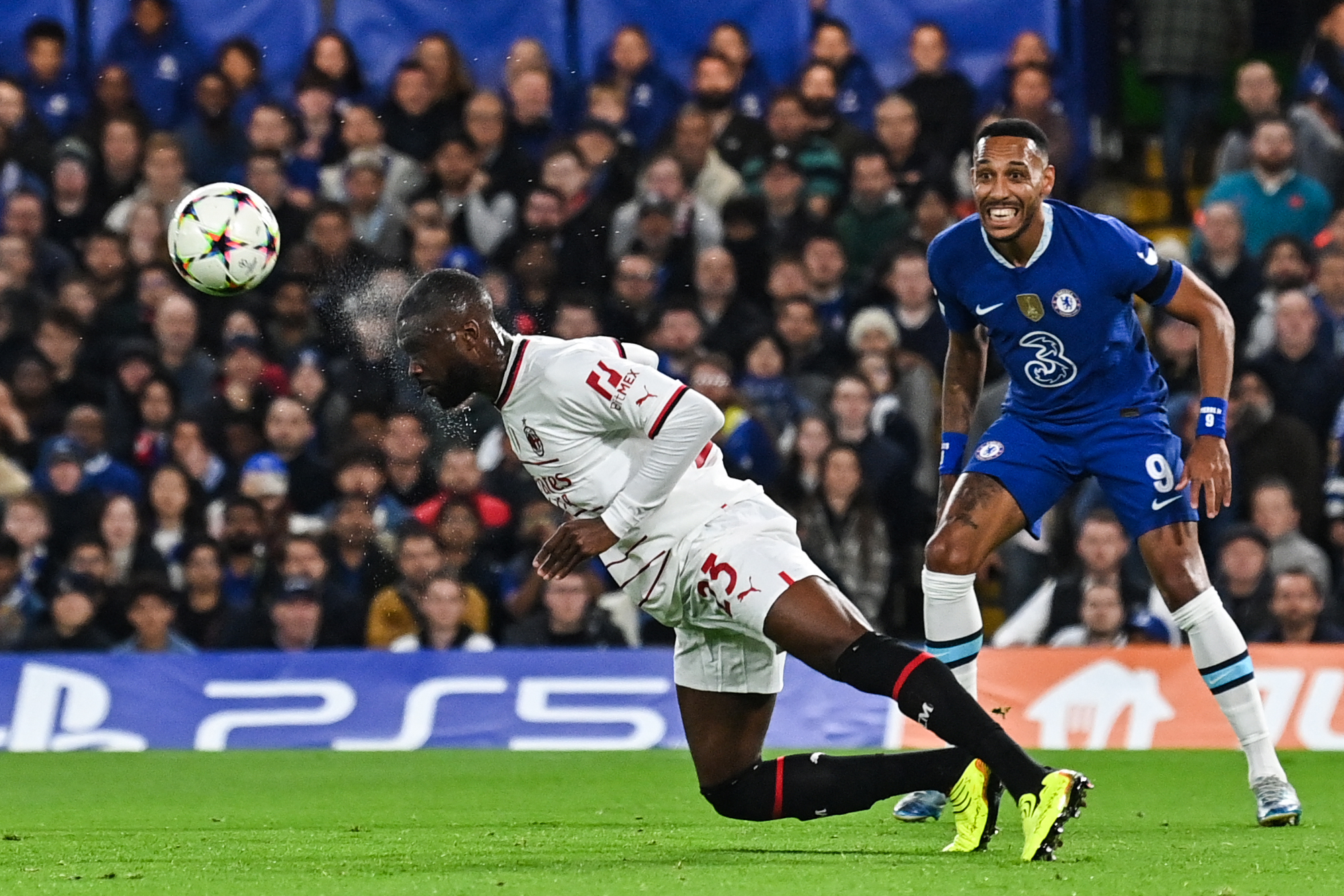 AC Milan's Fikayo Tomori heads the ball in front of Chelsea's Pierre-Emerick Aubameyang at Stamford Bridge in October 2022.