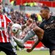 Pontus Jansson of Brentford vies for the ball with Arsenal's Gabriel Jesus.