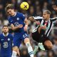 Newcastle player Bruno Guimaraes challenges Conor Gallagher of Chelsea.