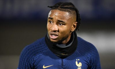 France's national football team forward Christopher Nkunku (R) reacts after being injured during a training session at the team's training camp in Clairefontaine-en-Yvelines, south of Paris, on November 15, 2022, five days ahead of the Qatar 2022 FIFA World Cup football tournament