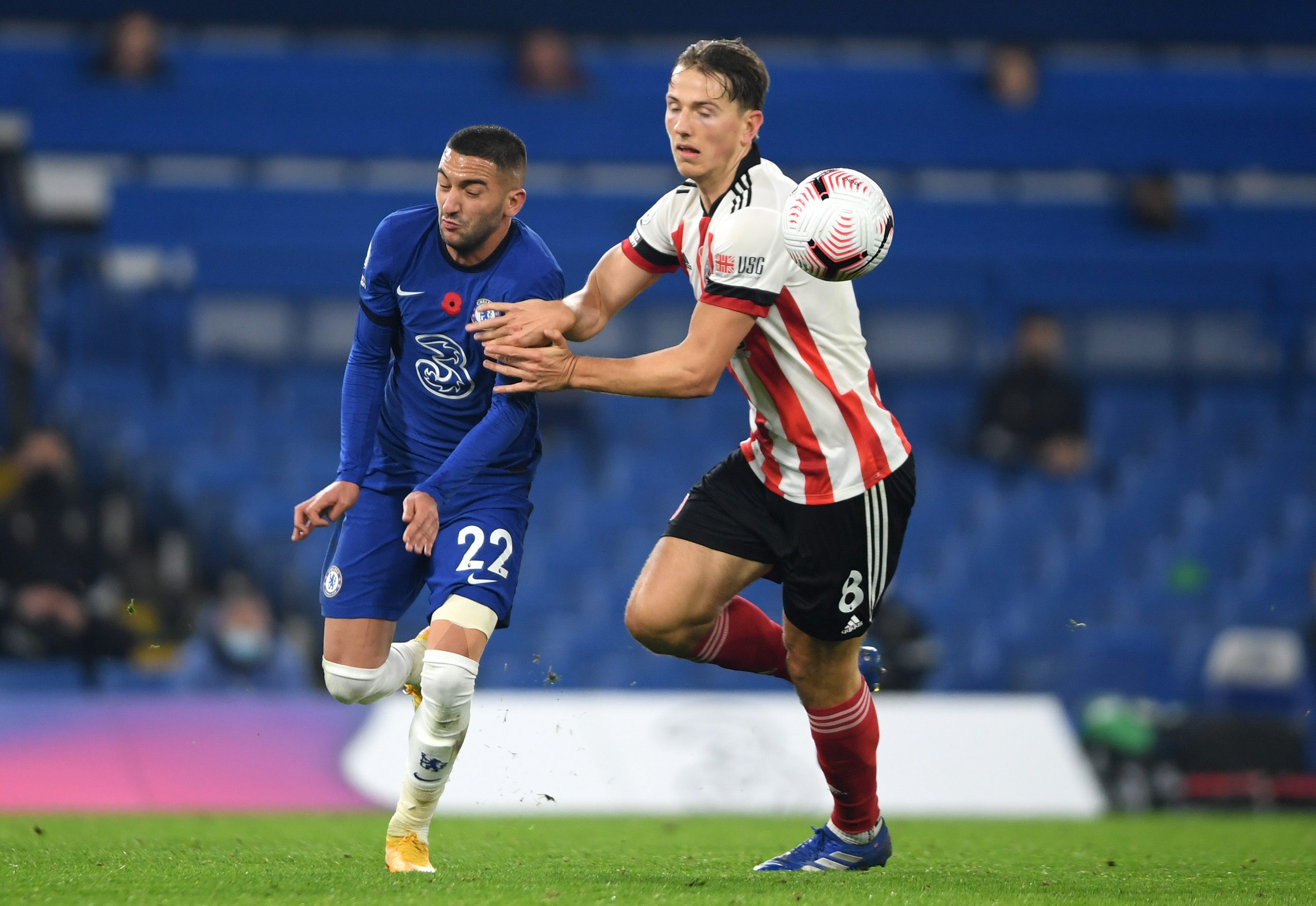 Hakim Ziyech of Chelsea battle for possession with Sander Berge of Sheffield United.