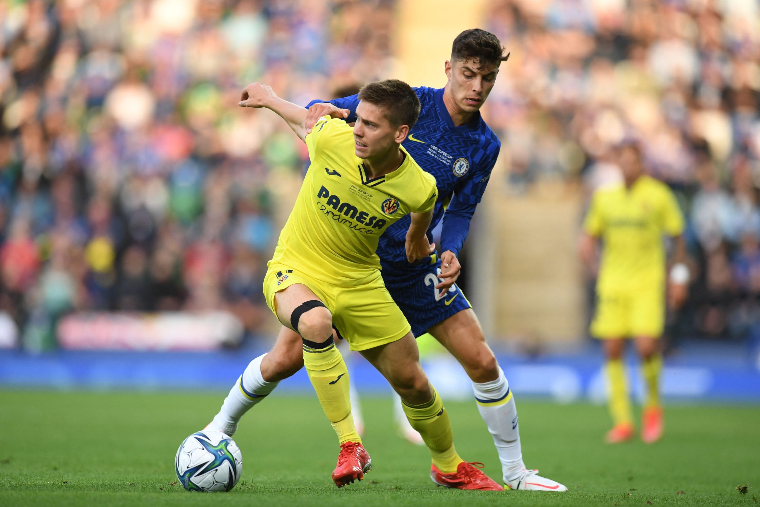 Villarreal's Juan Foyth tries to hold off Chelsea's Kai Havertz.