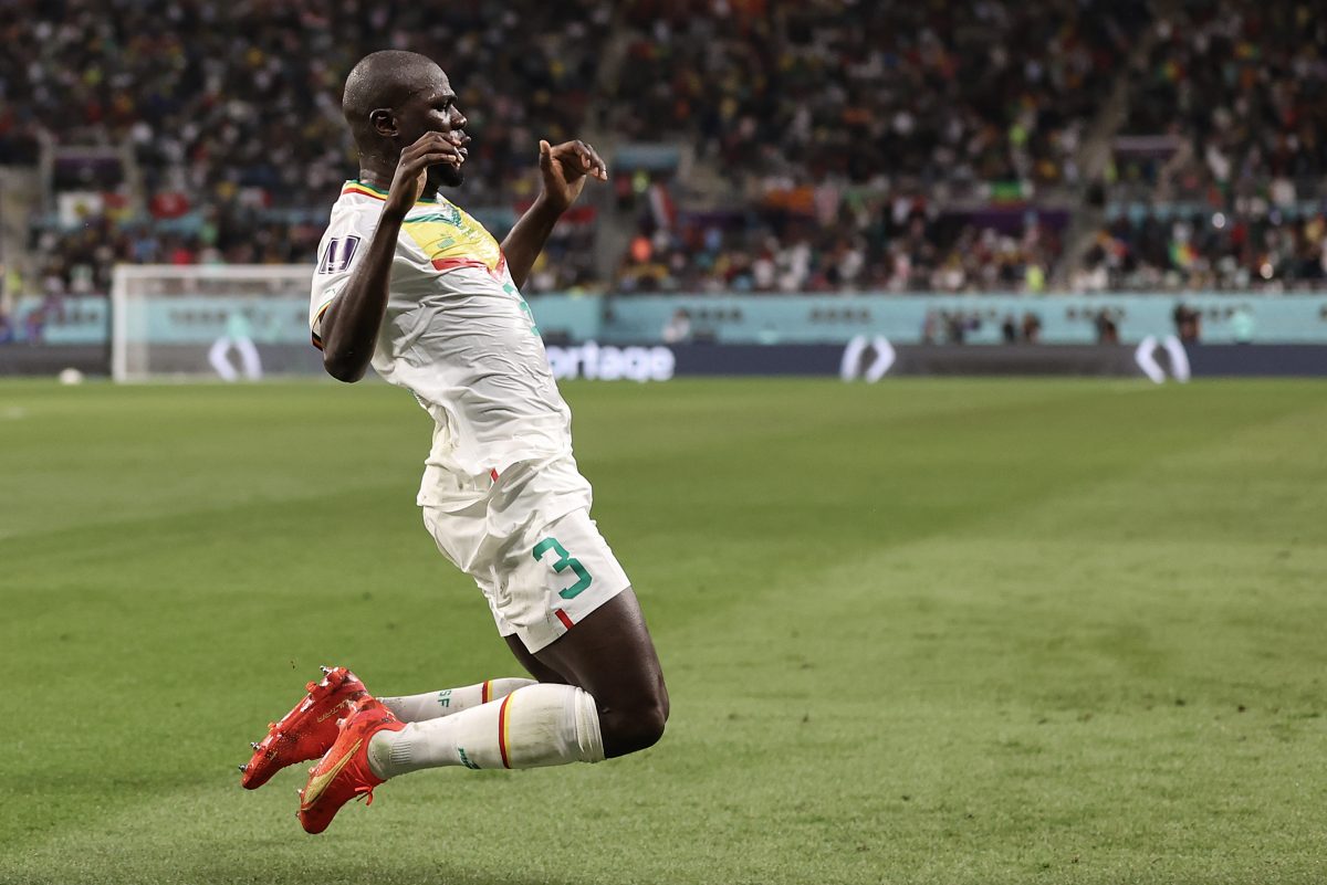 Kalidou Koulibaly of Senegal celebrates scoring a hugely important FIFA World Cup goal against Ecuador.