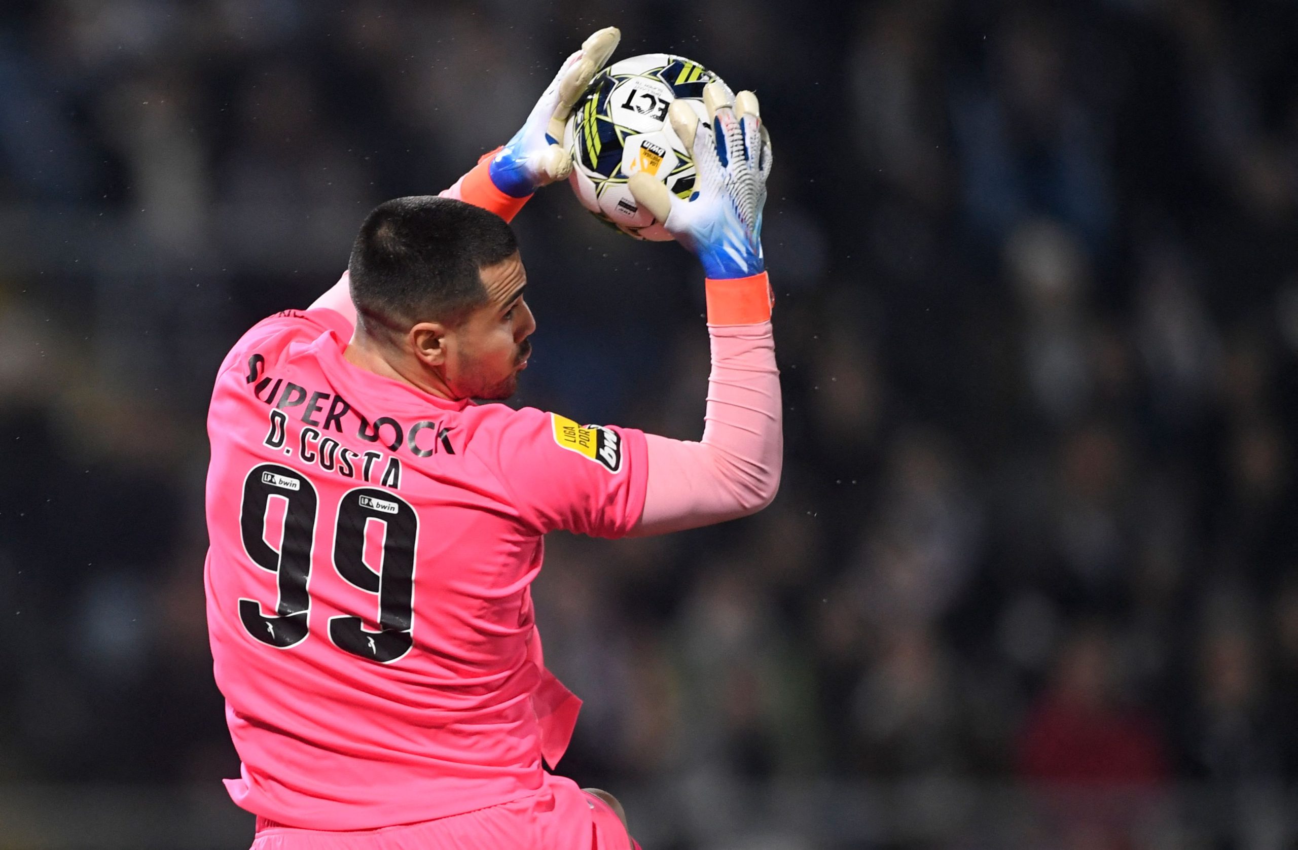 FC Porto's Portuguese goalkeeper Diogo Costa catches the ball during the Portuguese league football match between Vitoria Guimaraes SC and FC Porto at the Dom Afonso Henriques stadium in Guimaraes on January 21, 2023.