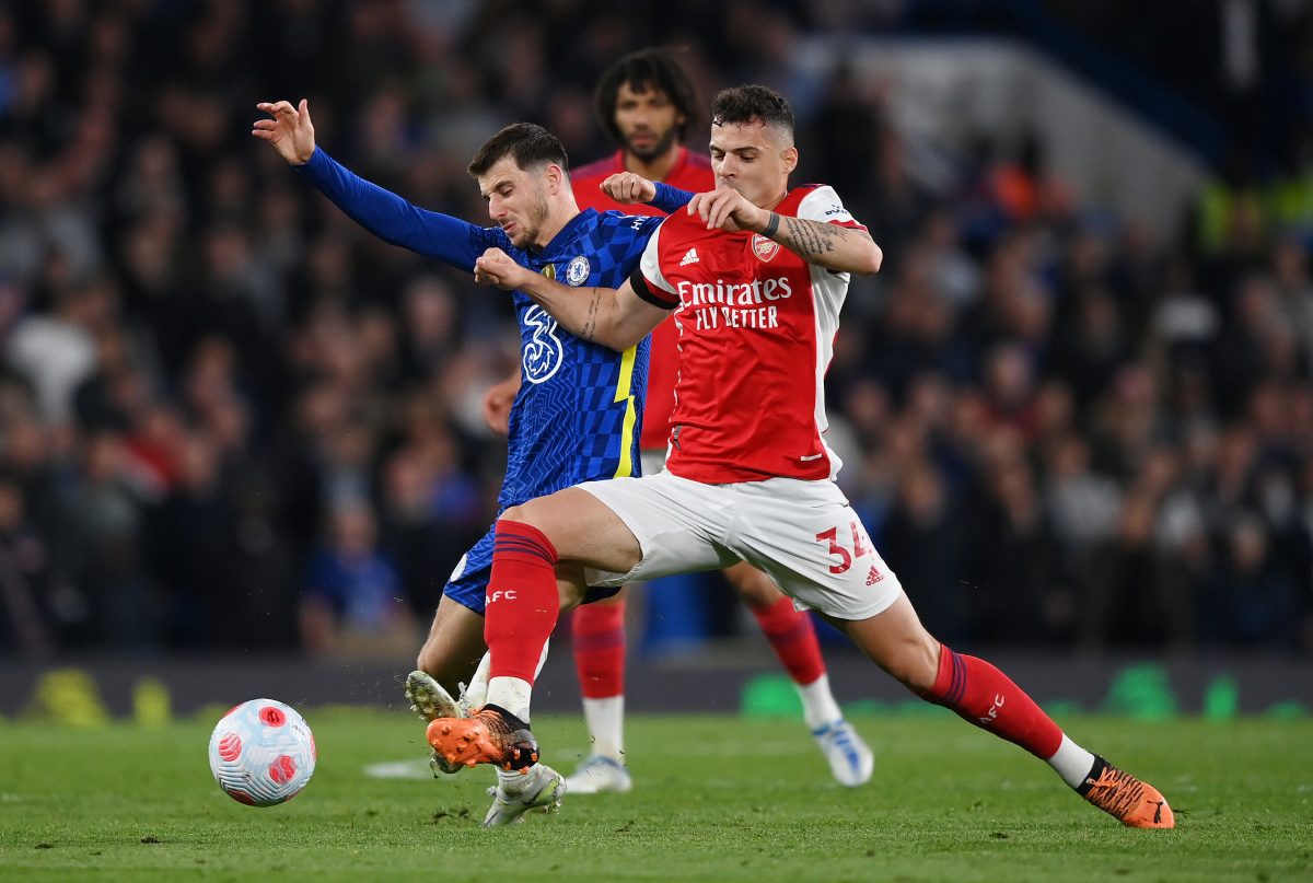 Mason Mount of Chelsea is challenged by Granit Xhaka of Arsenal. 