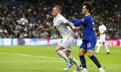 Toni Kroos of Real Madrid is challenged by Joao Felix of Chelsea.