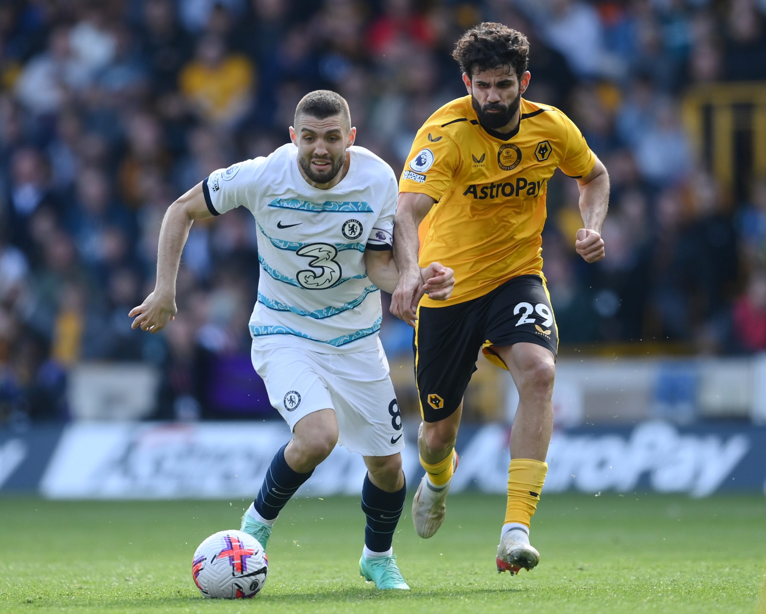 Mateo Kovacic of Chelsea is challenged by Diego Costa of Wolverhampton Wanderers.