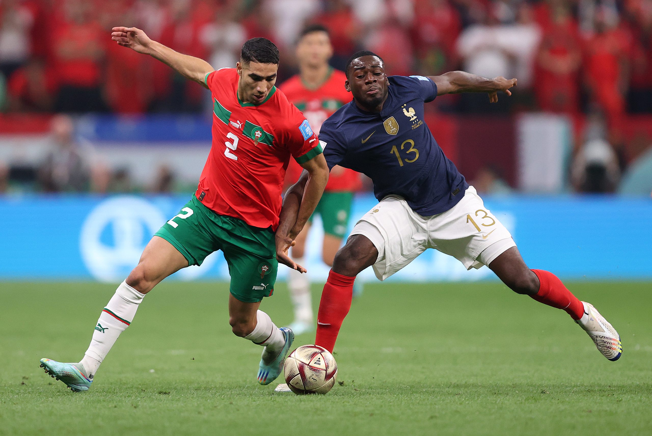 Achraf Hakimi of Morocco battles with Youssouf Fofana of France during the FIFA World Cup Qatar 2022 semi final.