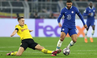 Ruben Loftus-Cheek of Chelsea is challenged by Nico Schlotterbeck of Borussia Dortmund.