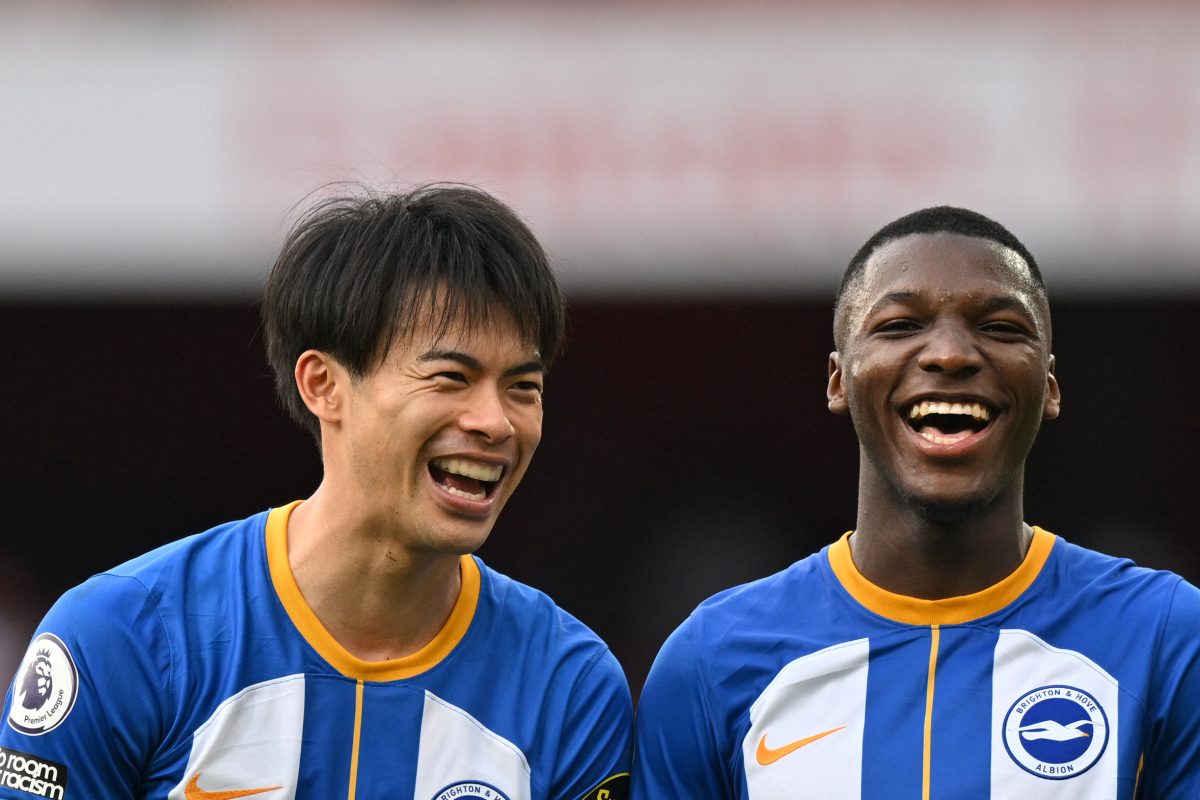 Brighton's Japanese midfielder Kaoru Mitoma and Moises Caicedo.  (Photo by GLYN KIRK/AFP via Getty Images)