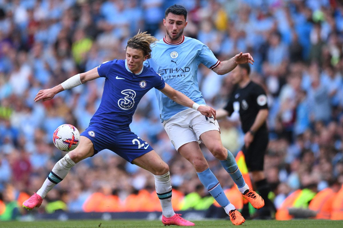 Chelsea's English midfielder Conor Gallagher (L) vies with Manchester City's French-Spanish defender Aymeric Laporte.