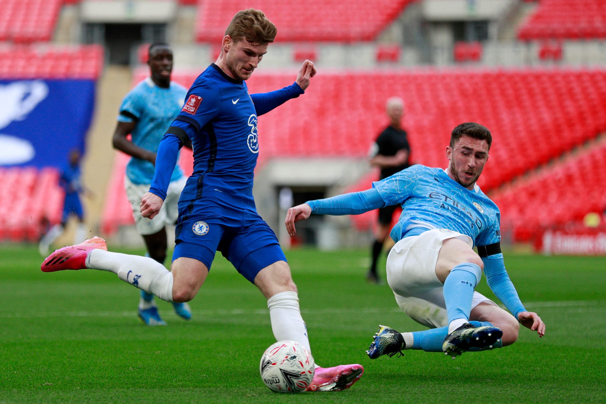 Chelsea's German striker Timo Werner (L) vies for possession with Manchester City's Aymeric Laporte.