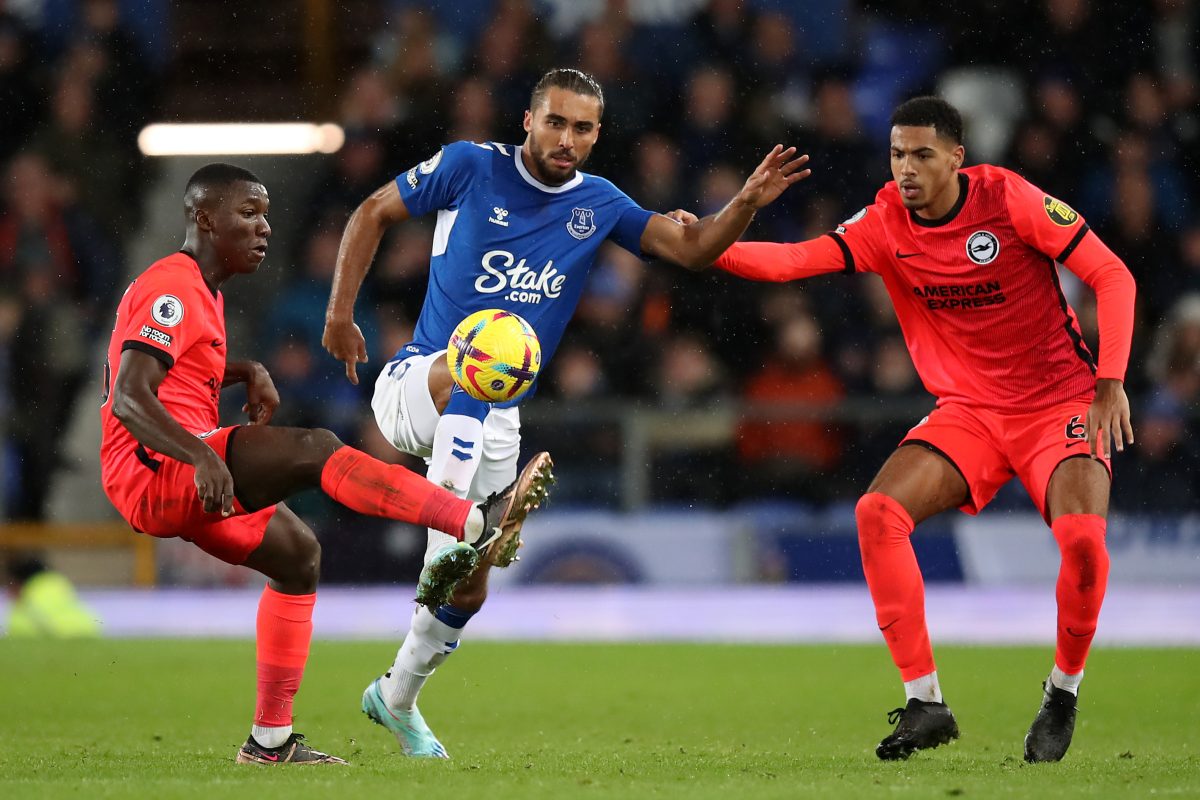 Dominic Calvert-Lewin of Everton is challenged by Moises Caicedo and Levi Colwill of Brighton and Hove Albion.