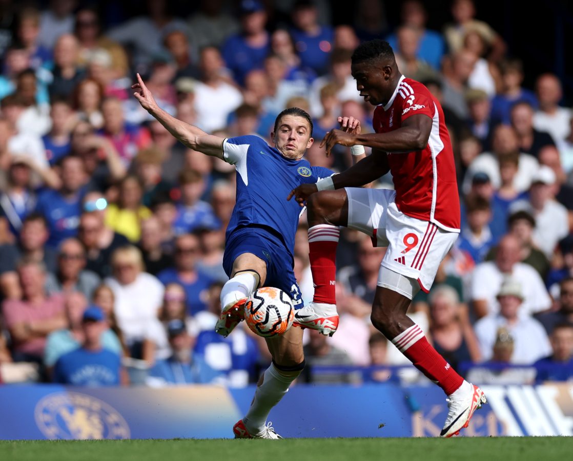 Conor Gallagher of Chelsea is challenged by Taiwo Awoniyi of Nottingham Forest. 
