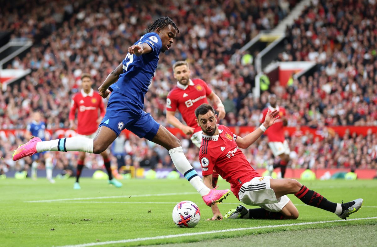 Carney Chukwuemeka of Chelsea is tackled by Bruno Fernandes of Manchester United. (Photo by Catherine Ivill/Getty Images)